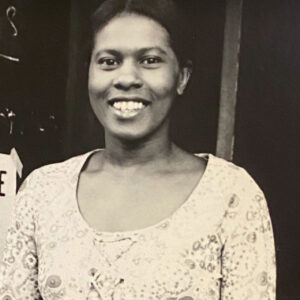 A black and white portrait of a woman.