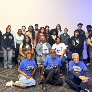 A large group poses for the camera.