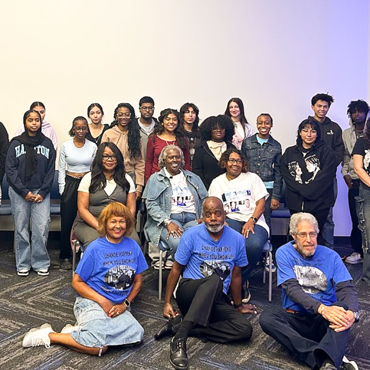 A large group poses for the camera.